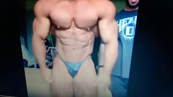 Hot bodybuilder posing in tiny thongs