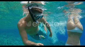 Seeing the perfect body and the best buttock of the female snorkel diver on the coral reefs